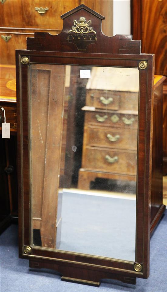 A French Empire style mahogany and brass mounted wall mirror, 3ft 11in. x 1ft 11.75in.